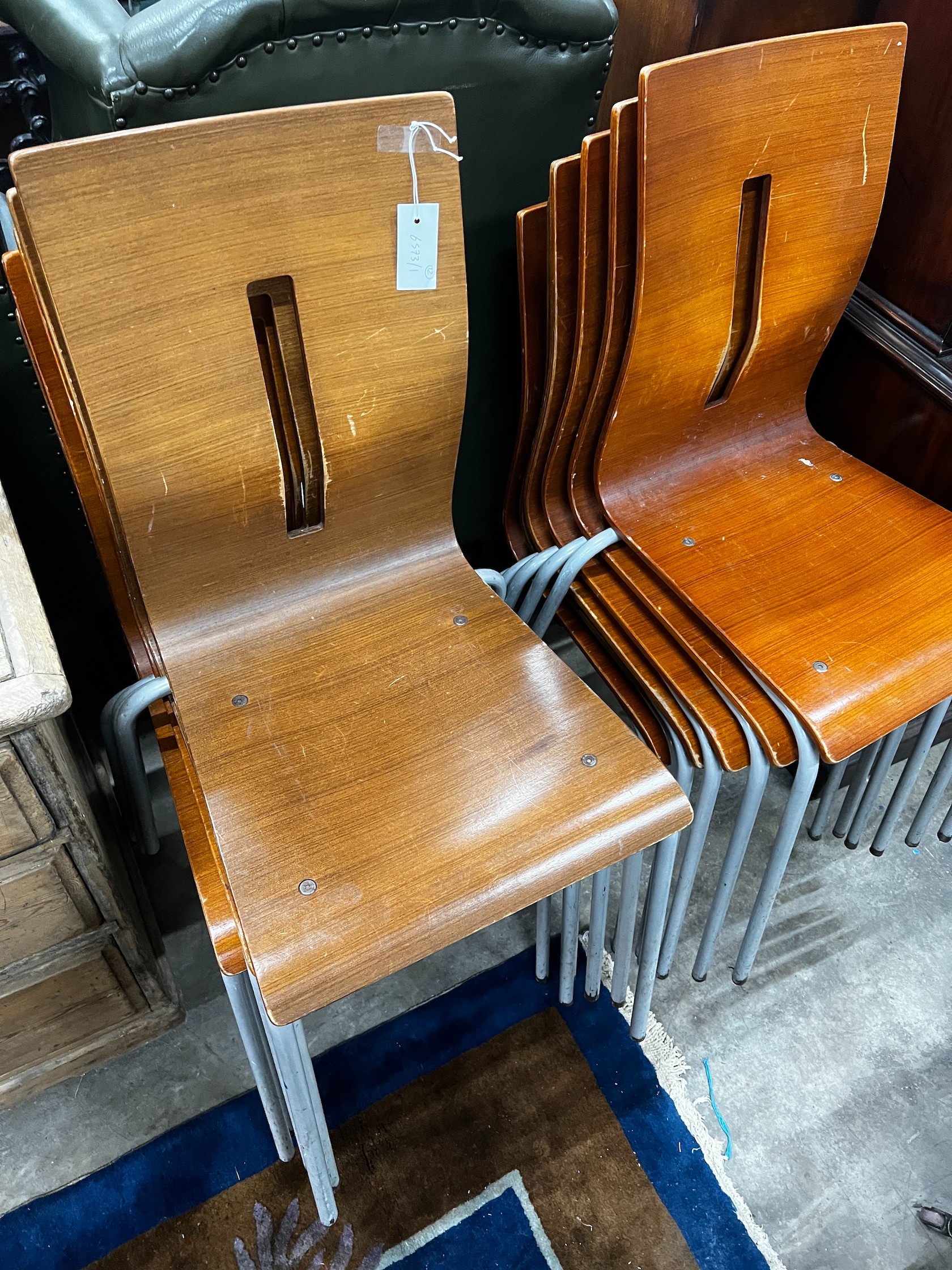 A set of twelve bent plywood stacking chairs